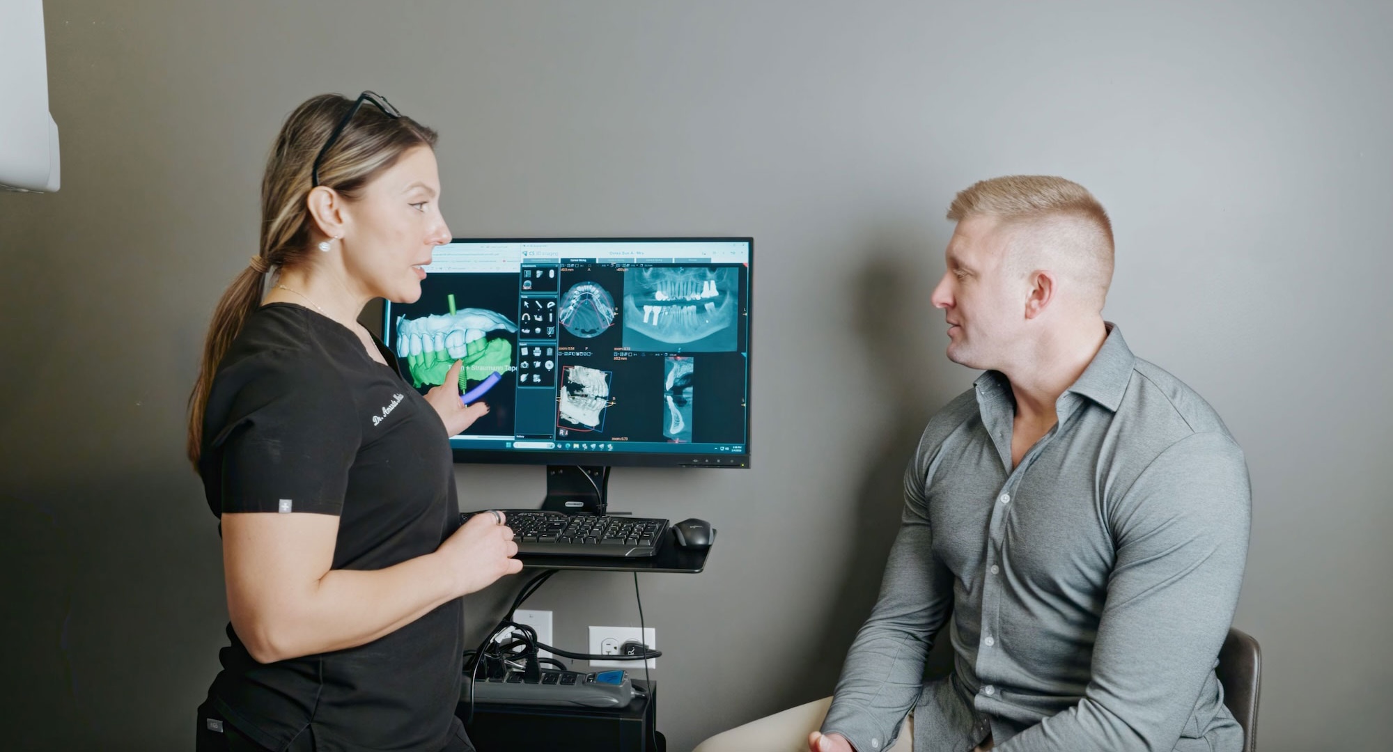 winnetka dental group doctor merikas helping a petinet